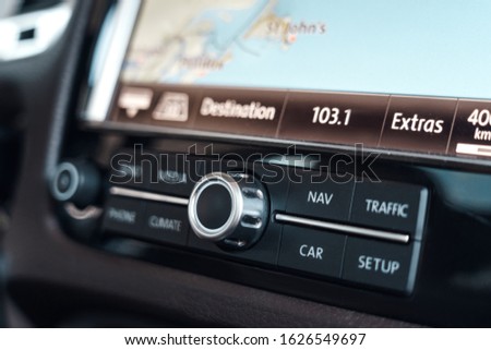 Electric car interior control panel close-up mode of transport mp3 player digital screen with radio playing