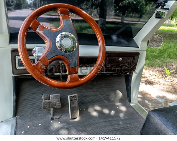 electric car, large parts of the steering wheel\
and pedals.