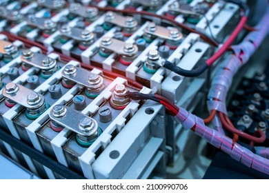 Electric car lithium battery pack and wiring connections internal between cells on background.