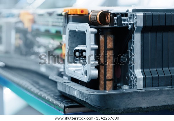 Electric car\
lithium battery pack and power connections. Electric car battery\
during maintenance. Blue\
toned