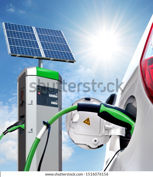 Electric car on charging station with\
solar panels with back light,\
Solartankstelle