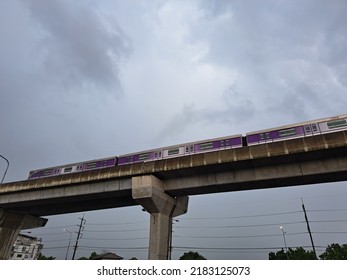 An Electric Car Parked On The Sky Rail At The Time Of The Rain, The Atmosphere Was Gloomy.