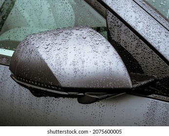 Electric Car Rear View Mirror With Hidden CCTV Camera Guidance In The Lower Part - Covered With Rain Drops