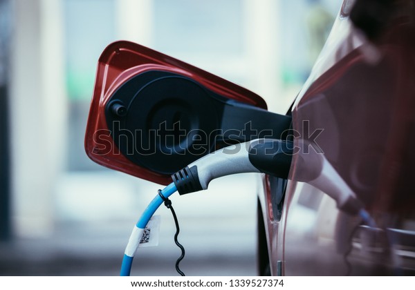 Electric car recharging with charge cable and plug
leading to charge
point