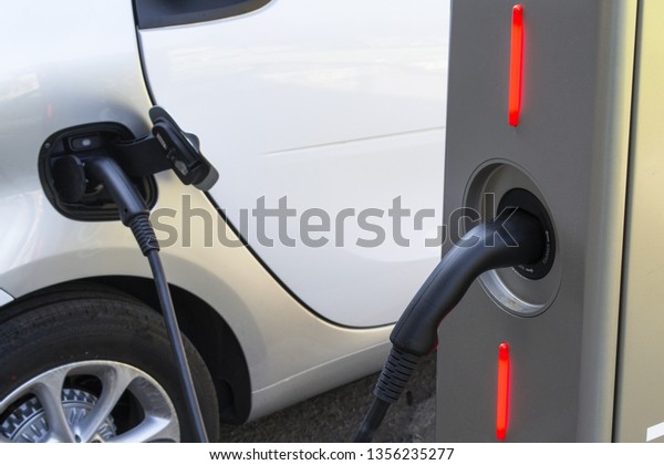 electric car in a recharging\
post