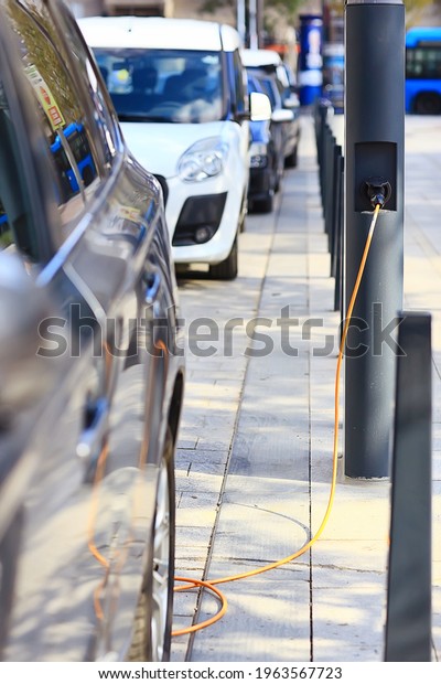 electric car refueling, technology green transport\
energy concept in city