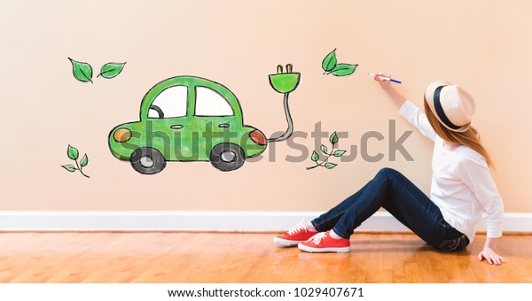 Electric Car\
with young woman holding a pen on\
floor
