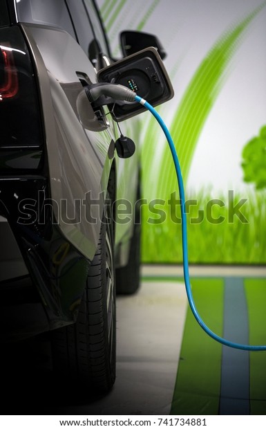 Electric cars charged\
on a charging station