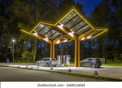 Electric cars charging at electricity filling station in the fast expanding car charging network in the Netherlands