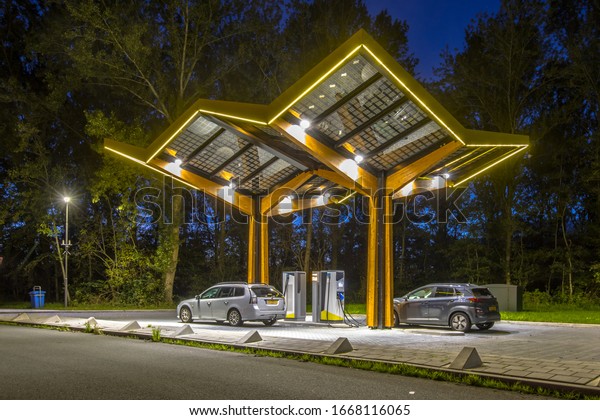 Electric cars\
charging at electricity filling station in the fast expanding car\
charging network in the\
Netherlands