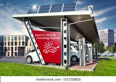 Electric Cars On Solar Charging Station With Solar Energy And City Buildings