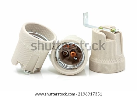 Electric ceramic socket model E27, for lighting. Selective focus with shallow depth of field.