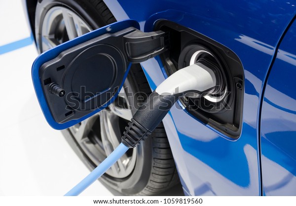 Electric charger on EV or electric vehicle. Electric car\
power recharging 