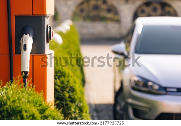 Electric charging\
station for charging cars. Charge station for electric cars.\
Electric car charger on\
street.