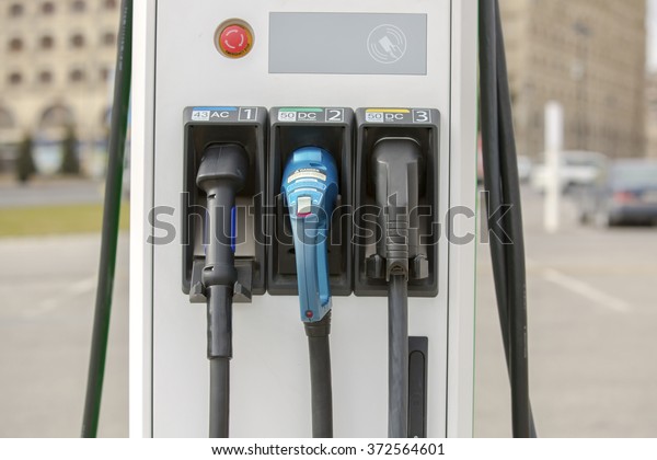 The electric charging station for electric\
vehicles. An electric car charging. \
