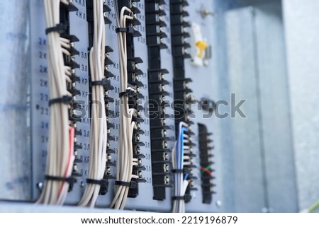 Electric control panel. The wires are connected to residual current circuit breakers and voltage monitoring relays. High quality photo