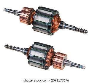 Electric DC motor rotors with copper commutator and coil wire winding isolated on white background. Two engine parts with steel laminations. Worm screw shaft on one side and grooving for fan on other.
