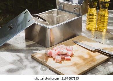 Electric Deep Fryer With Ingredients For Making Tonkatsu Stuffed With Cheese.