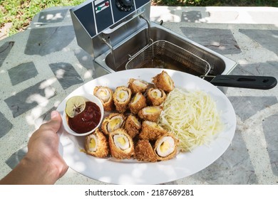 Electric Deep Fryer With Pork Tonkatsu Stuffed With Cheese.