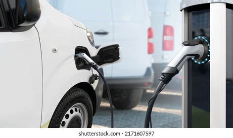Electric delivery van with electric vehicles charging station.  - Shutterstock ID 2171607597