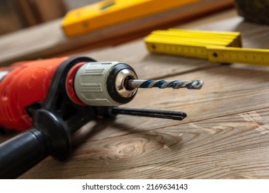 Electric Drill Tool On Carpenter Work Bench Table Closeup View. Home Repair, Diy And Fix Concept