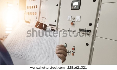 The Electric Enginering checklist and maintenance electric panel in  power house.preventive maintenance schedule for electrical panel boards.with shiny light.