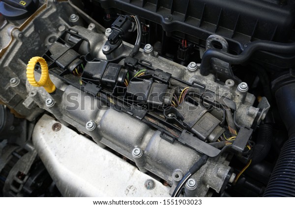 \
Electric equipment of the engine of a\
modern car. Ignition coils mounted on the engine, wiring harnesses,\
control sensors. Diagnostic and electrical\
work.