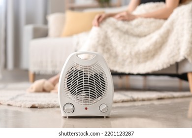 Electric fan heater on floor in living room, closeup - Shutterstock ID 2201123287