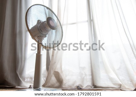 An electric fan taken with the image of hot summer