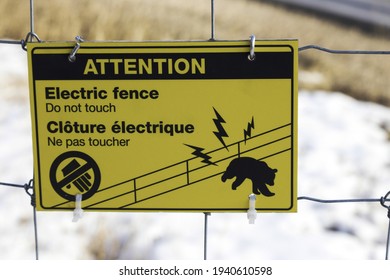 Electric Fence Warning Sign.  Protection Of Wildlife Migration Corridor In Banff National Park, Canada