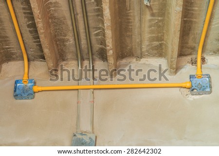 Electric flash- light boxes are installed and connected to power lines, cables and pipes, Wall Building Materials.