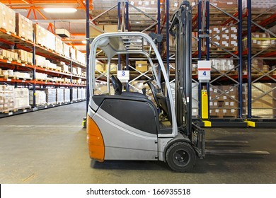 Electric Forklift In Distribution Warehouse