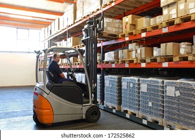 Electric Forklift In Distribution Warehouse