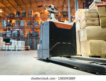 Electric Forklift Pallet Jack In Distribution Warehouse.