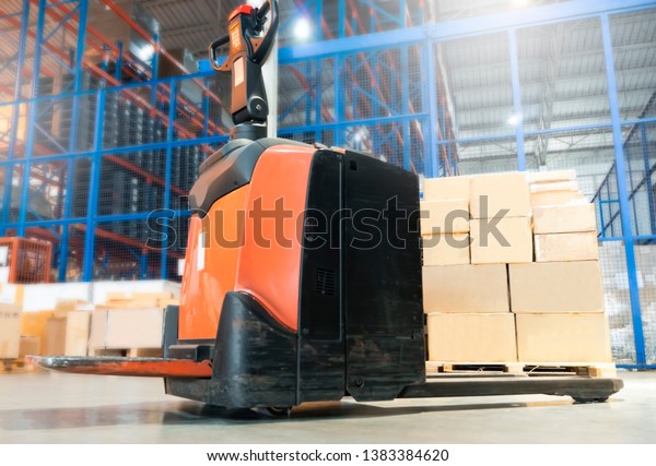Electric\
forklift pallet jack in distribution\
warehouse