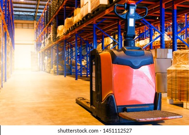 Electric Forklift Pallet Jack At Warehouse.