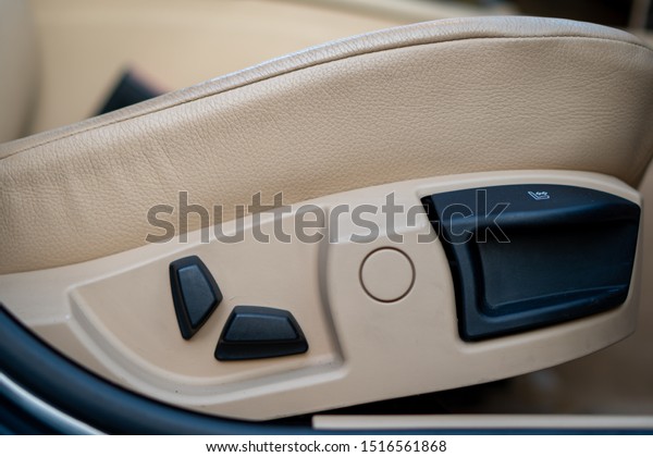 Electric\
front passenger seat in beige leather\
upholstery