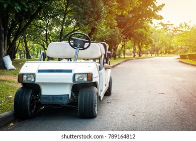 Electric Golf Cart Without Roof On The Road.