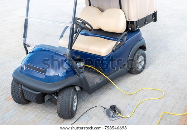 Electric golf carts\
charging and ready to\
use