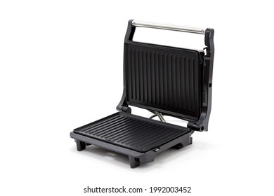 Electric grill. High quality of work and meals received. Non-stick Teflon coating. Large grill surface. Non-heating handle. Grease tray. Vertical storage. White background. - Shutterstock ID 1992003452