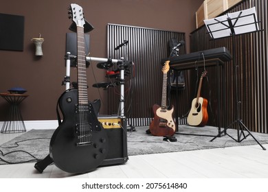 Electric guitar with amplifier at recording studio. Music band practice