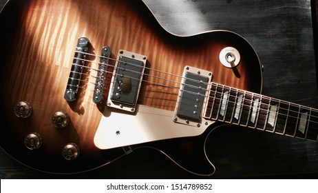 electric guitar body closeup on  the wooden board - Powered by Shutterstock