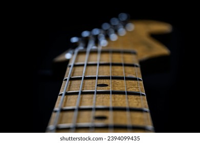 electric guitar neck close up, black background - Powered by Shutterstock