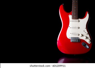 Electric guitar on black background. Free space for text