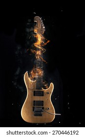 Electric Guitar on fire Isolated on Black Background