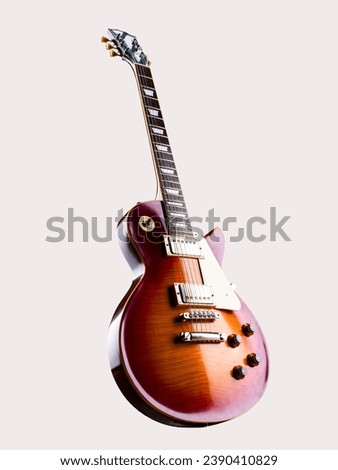 Electric guitar on a white background. Beautiful electric guitar isolated on a white background. Beautiful rosewood electric guitar