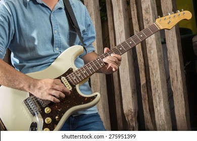 Electric Guitar Player, Playing With Old Wooden Background