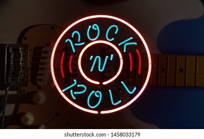 Electric Guitar With Rock N Roll Neon Sign