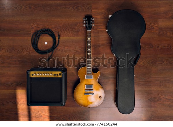 electric\
guitar with speaker and case seen from top\
view