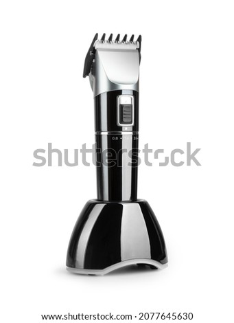 Electric Hair clipper trimmer in the charger isolated on white background. With clipping path